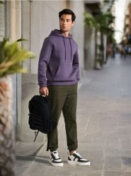 Spodnie jogger - zielony. Zielone spodnie materiałowe męskie Sinsay, bez wzorów, z bawełny. Za 49.99 zł.