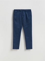 Spodnie chino slim - granatowy. Niebieskie spodnie materiałowe męskie Reserved, bez wzorów, z bawełny. Za 149.99 zł.