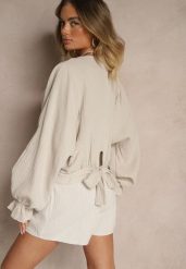 Beżowa Bawełniana Bluzka Typu Nietoperz z Wiązaniem Sepionna. Brązowe bluzki damskie Renee, bez wzorów, z bawełny, eleganckie, bez kołnierzyka, bez ramiączek. Za 99.99 zł.