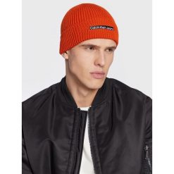 Czapka Calvin Klein Jeans. Brązowe czapki męskie Calvin Klein Jeans, na zimę, bez wzorów, z jeansu. Za 189.99 zł.