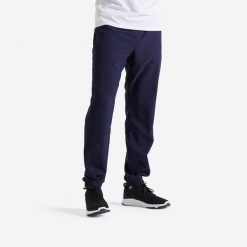 Spodnie fitness męskie Domyos regular. Niebieskie spodnie sportowe męskie DOMYOS, z materiału. Za 69.99 zł.