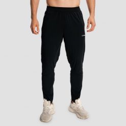 Spodnie męskie do biegania slim czarne Pulse X. Czarne spodnie materiałowe męskie GYMBEAM, bez wzorów, z elastanu, wakacyjne. Za 127.90 zł.