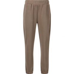 Damskie spodnie dresowe Athlecia Jillnana V2. Brązowe spodnie dresowe damskie Athlecia, bez wzorów, z dresówki. Za 253.00 zł.