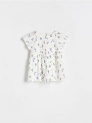 Bawełniana sukienka - złamana biel. Sukienki dziewczęce Reserved, bez wzorów, z bawełny, bez ramiączek. W wyprzedaży za 22.99 zł.