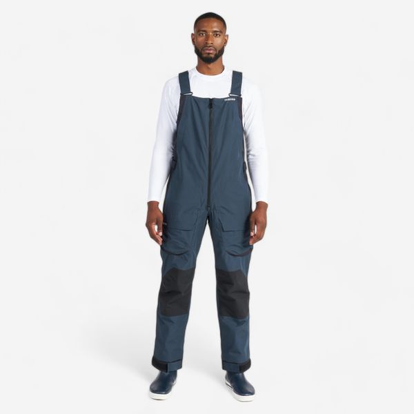 Spodnie żeglarskie męskie Decathlon Sailing 500 na szelkach. Czarne spodnie materiałowe męskie Decathlon, bez wzorów, z polaru, sportowe. Za 399.99 zł.