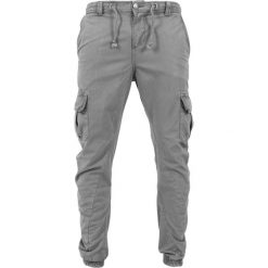 Spodnie Cargo Urban Classics. Szare spodnie materiałowe męskie Urban Classics, bez wzorów, z bawełny, klasyczne. Za 198.75 zł.