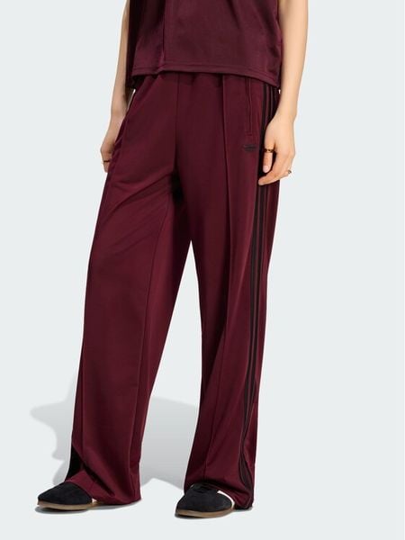 Adidas Spodnie dresowe Firebird Loose Tracksuit KS4669 Bordowy Loose Fit. Czerwone spodnie dresowe damskie Adidas, xs, bez wzorów, z dresówki. Za 208.99 zł.
