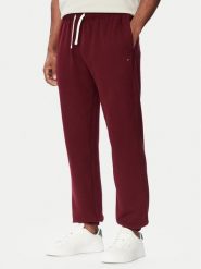 Tommy Hilfiger Spodnie dresowe Essential MW0MW37231 Bordowy Regular Fit. Czerwone spodnie dresowe męskie Tommy Hilfiger, bez wzorów, z bawełny. Za 449.99 zł.