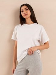Bawełniana jednolita koszulka z krótkim rękawem - biały. Białe t-shirty damskie Sinsay, l, bez wzorów, z bawełny, bez kołnierzyka. Za 19.99 zł.