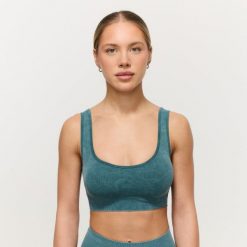 Biustonosz damski fitness bezszwowy Lift Petrol. Niebieskie biustonosze sportowe damskie GYMBEAM, bez wzorów, z elastanu. Za 85.90 zł.