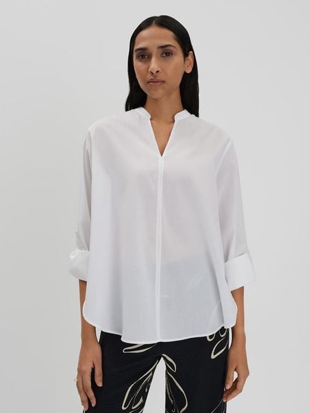 Someday Bluzka w kolorze kremowym rozmiar: 40. Brązowe bluzki damskie Someday, bez wzorów, z bawełny, bez kołnierzyka, bez ramiączek. Za 209.95 zł.