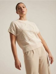 Sweter bez rękawów z tłoczonym kwiatem - biały. Białe swetry klasyczne damskie Sinsay, l, bez kołnierzyka. Za 49.99 zł.