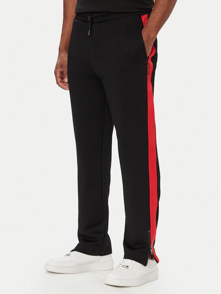 HUGO Spodnie dresowe Dolos 50551351 Czarny Relaxed Fit. Czarne spodnie dresowe męskie Hugo, bez wzorów, z dresówki. Za 599.99 zł.