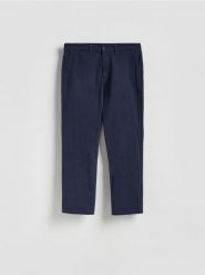 Spodnie joggery - granatowy. Niebieskie spodnie materiałowe męskie Reserved, bez wzorów, z bawełny. Za 139.99 zł.