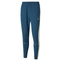 Puma Spodnie Run Tapered 52085865. Niebieskie spodnie dresowe męskie Puma, bez wzorów, z dresówki. W wyprzedaży za 233.95 zł.
