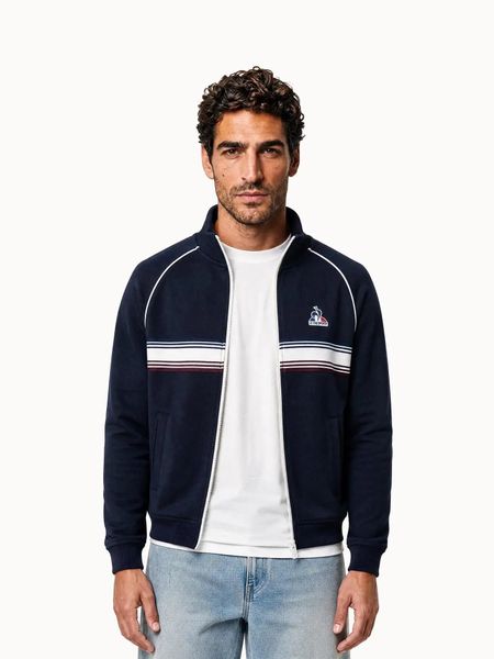 Bluza z pełnym zamkiem błyskawicznym Le Coq Sportif Tri. Niebieskie bluzy bez kaptura męskie Le Coq Sportif, bez wzorów, z materiału, eleganckie, bez kołnierzyka, bez ramiączek. Za 618.00 zł.