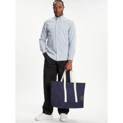 Torebka Tommy Hilfiger. Niebieskie torebki klasyczne damskie Tommy Hilfiger, bez wzorów, bez dodatków. Za 269.99 zł.