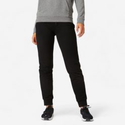 Spodnie dresowe damskie Nyamba Gym & Pilates 500 regular. Czarne spodnie sportowe damskie DOMYOS, l, z bawełny, na fitness i siłownię. Za 29.99 zł.