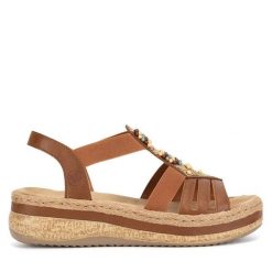 Sandały Rieker. Brązowe sandały damskie Rieker, bez wzorów, bez obcasa, na koturnie. Za 329.99 zł.