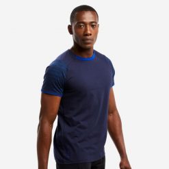 Koszulka piłkarska dla dorosłych Kipsta T100 drużynowa. Niebieskie t-shirty sportowe męskie KIPSTA, s, z bawełny, bez ramiączek, na fitness i siłownię. Za 29.99 zł.