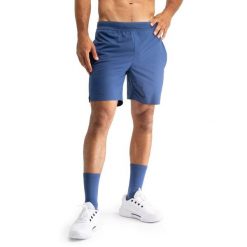 Męskie techniczne spodenki tenisowe Siroko Velozix Blue. Niebieskie szorty męskie SIROKO, bez wzorów, z materiału. Za 171.00 zł.