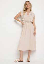 Beżowa Rozkloszowana Sukienka Ozdobiona Paskiem z Klamrą Tinilsa. Brązowe sukienki damskie Born2be, na spacer, m, bez wzorów, eleganckie, bez kołnierzyka, bez ramiączek, midi, kopertowe. W wyprzedaży za 87.99 zł.