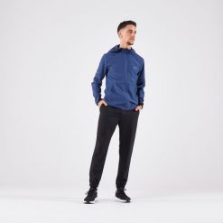 Spodnie do biegania męskie Kiprun Run 100 Dry. Czarne spodnie materiałowe męskie KIPRUN, bez wzorów, z materiału, sportowe. Za 89.99 zł.