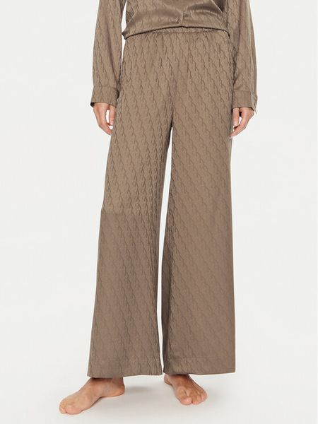 Calvin Klein Spodnie piżamowe 000QS7304E Brązowy Relaxed Fit. Brązowe piżamy damskie CALVIN KLEIN, s, bez wzorów, z syntetyku, bez ramiączek. Za 179.99 zł.