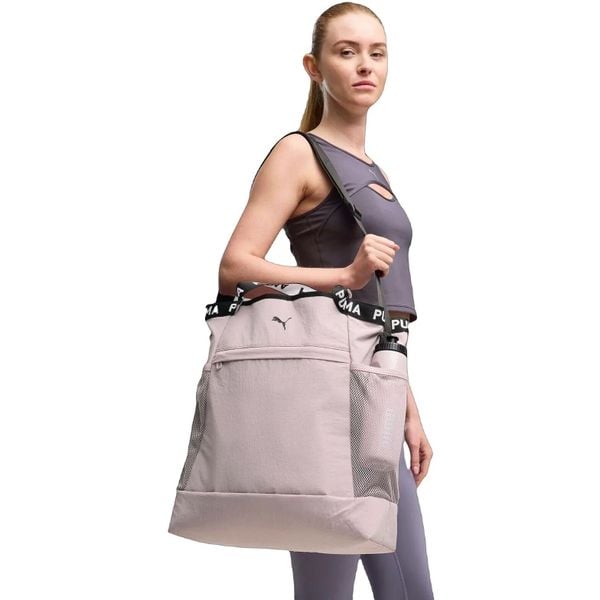 Torba damskie Puma At Ess Tote Bag 26.5L. Fioletowe torebki klasyczne damskie Puma, bez wzorów, z materiału, bez dodatków. Za 290.00 zł.