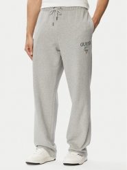 Guess Jeans Spodnie dresowe M6YB15 K4842 Szary Regular Fit. Szare spodnie dresowe męskie Guess Jeans, z aplikacjami, z bawełny. Za 299.99 zł.