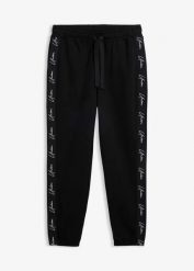 Spodnie joggingowe z czystej bawełny organicznej o kroju loose fit. Czarne spodnie dresowe męskie bonprix, bez wzorów, z bawełny. Za 109.99 zł.
