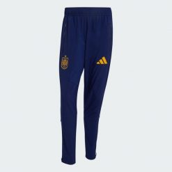 Spodnie Hiszpania Tiro Travel. Niebieskie spodnie sportowe męskie Adidas, z elastanu. Za 329.00 zł.