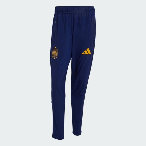 Spodnie Hiszpania Tiro Travel. Niebieskie spodnie sportowe męskie Adidas, z elastanu. Za 329.00 zł.