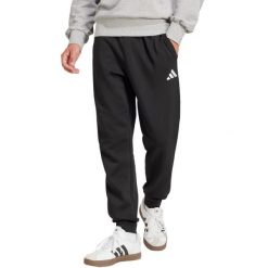 Spodnie męskie adidas Essentials Feelcozy. Czarne spodnie sportowe męskie Adidas, z bawełny. Za 171.99 zł.