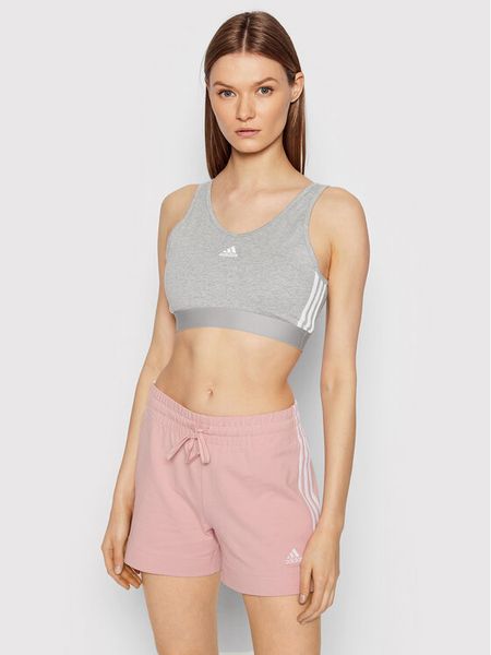 Adidas Biustonosz top Essentials GS1357 Szary. Szare biustonosze sportowe damskie Adidas, xs, bez wzorów, z bawełny, bez kołnierzyka. Za 79.99 zł.
