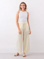 IVY & OAK Spodnie w kolorze jasnożółtym rozmiar: 34. Żółte spodnie materiałowe damskie Ivy & Oak, bez wzorów, z materiału. Za 109.78 zł.