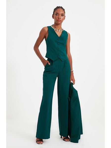 Trendyol Spodnie w kolorze morskim rozmiar: 40. Niebieskie spodnie materiałowe damskie Trendyol, bez wzorów, z materiału, z podwyższonym stanem. Za 61.75 zł.