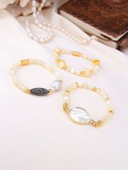 Pierres de Jade Pozłacane bransoletki (3 szt.) z perłami i kamieniami szlachetnymi rozmiar: onesize. Białe bransoletki damskie Pierres de Jade, pozłacane. Za 121.80 zł.