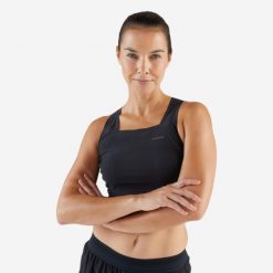 Koszulka do biegania bez rękawów damska Kiprun 900 Light crop top. Czarne bluzki sportowe damskie KIPRUN, l, z materiału, bez kołnierzyka, bez ramiączek. Za 129.99 zł.