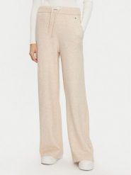 Tommy Hilfiger Spodnie dzianinowe UW0UW05523 Beżowy Relaxed Fit. Brązowe spodnie materiałowe damskie Tommy Hilfiger, bez wzorów, z dzianiny. Za 229.99 zł.