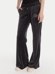 Guess Spodnie dresowe W6RB32 KCUF1 Granatowy Regular Fit. Niebieskie spodnie dresowe damskie Guess, s, z aplikacjami, z bawełny. Za 389.99 zł.