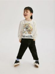 Bluza Tom i Jerry - złamana biel. Bluzy i bluzki niemowlęce Reserved, bez wzorów, z bawełny, bez ramiączek, bez kaptura. W wyprzedaży za 25.99 zł.