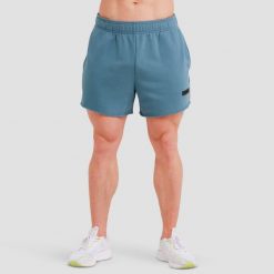 Szorty męskie fitness luźne niebieskie Unity. Niebieskie szorty męskie GYMBEAM, l, z bawełny, na fitness i siłownię. Za 76.90 zł.