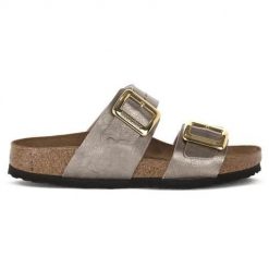 Klapki damskie Birkenstock Sydney. Żółte klapki damskie Birkenstock, bez wzorów, z materiału, bez obcasa. Za 654.40 zł.