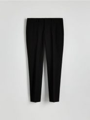 Garniturowe spodnie slim fit - czarny. Czarne spodnie wizytowe męskie Reserved, z tkaniny. W wyprzedaży za 99.99 zł.