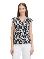 CARTOON Bluzka w kolorze biało-czarnym rozmiar: 34. Białe bluzki damskie Cartoon, bez wzorów, z wiskozy, bez kołnierzyka, bez ramiączek. Za 104.99 zł.