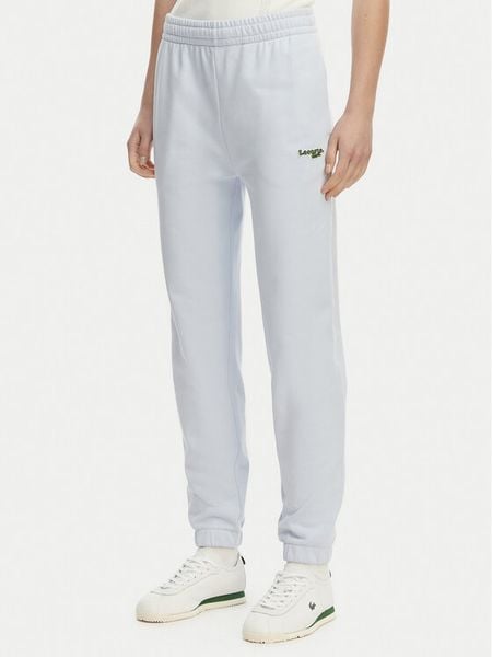 Lacoste Spodnie dresowe XF7604 Niebieski jasny Regular Fit. Niebieskie spodnie dresowe damskie Lacoste, bez wzorów, z bawełny. Za 569.99 zł.