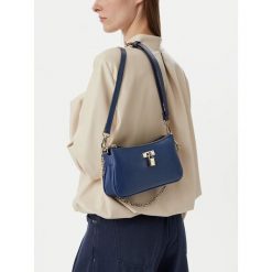 Torebka Nine West. Niebieskie torebki klasyczne damskie Nine West, bez wzorów, bez dodatków. Za 229.99 zł.
