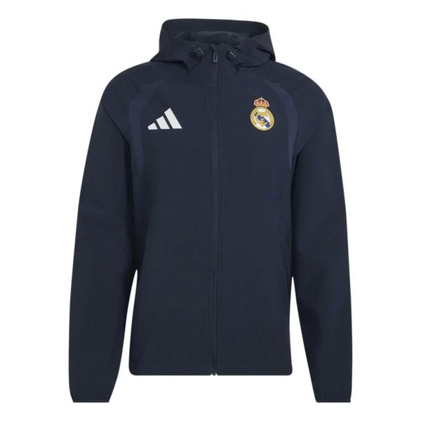 Kurtka przeciwwiatrowa z zamkiem Real Madrid Tiro 2026/27. Niebieskie kurtki męskie Adidas, l, bez wzorów, ze splotem, eleganckie, bez kaptura. Za 388.00 zł.