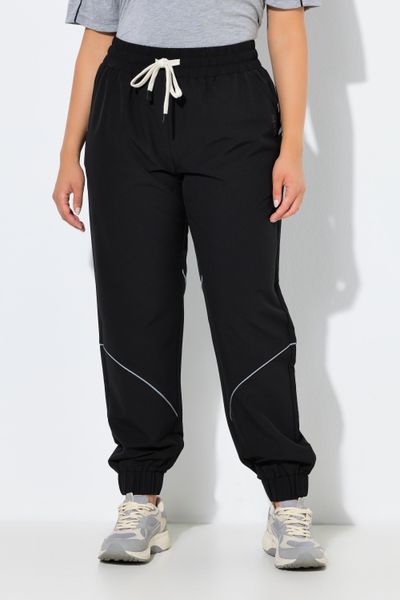 Damskie Funkcyjne spodnie treningowe hydrofobowe z elementami odblaskowymi. Czarne spodnie materiałowe damskie Ulla Popken, plus size, z materiału. Za 279.99 zł.